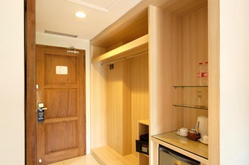 Imagen de la habitación del Hotel The Grand Hill Resort-Hotel. Foto 17