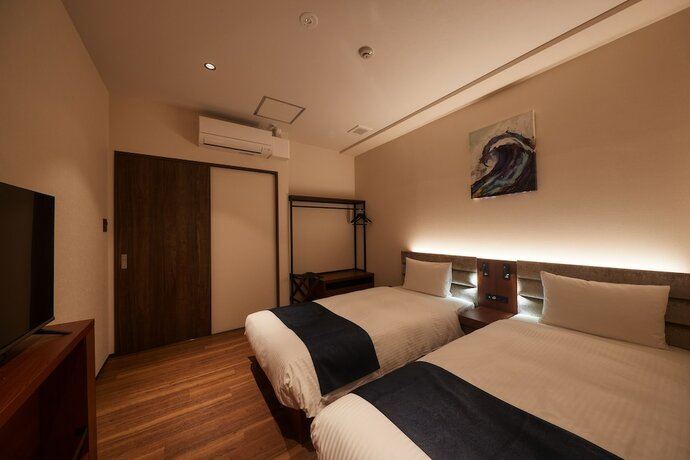 Imagen de la habitación del Hotel The Grand Hotel Ginowan. Foto 11