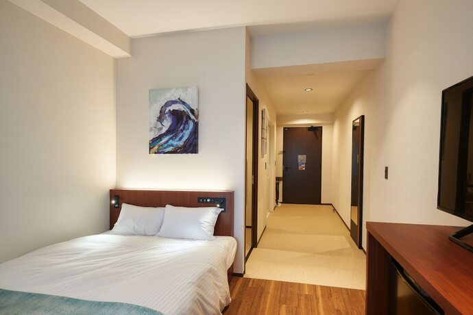 Imagen de la habitación del Hotel The Grand Hotel Ginowan. Foto 12