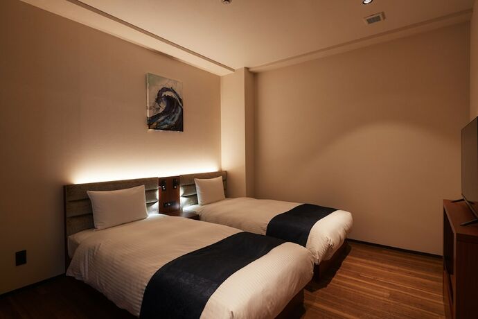Imagen de la habitación del Hotel The Grand Hotel Ginowan. Foto 14