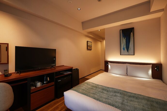 Imagen de la habitación del Hotel The Grand Hotel Ginowan. Foto 19