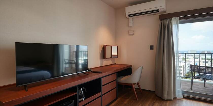 Imagen de la habitación del Hotel The Grand Hotel Ginowan. Foto 20