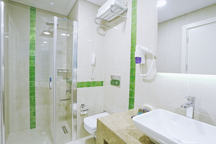 Imagen de la habitación del Hotel The Grand Mira. Foto 4