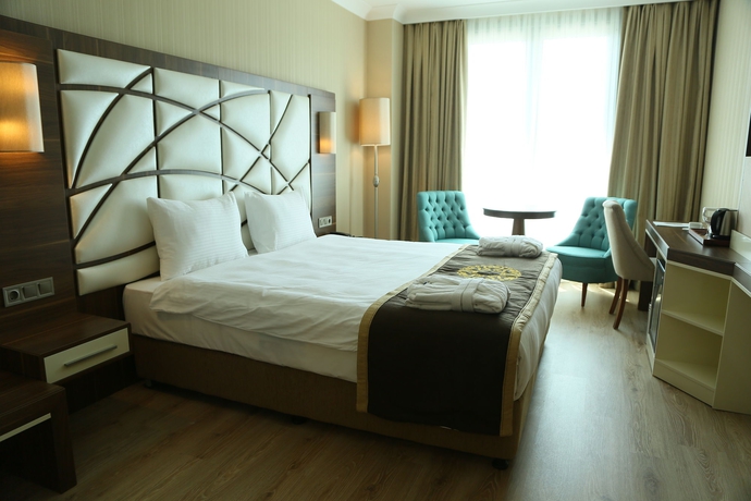 Imagen de la habitación del Hotel The Grand Mira. Foto 5