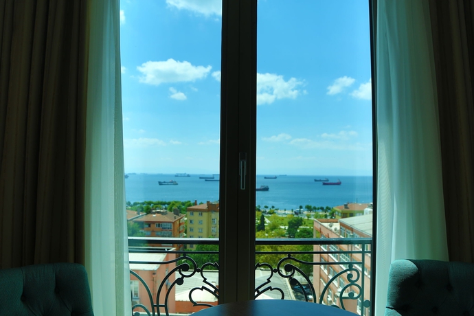 Imagen de la habitación del Hotel The Grand Mira. Foto 6