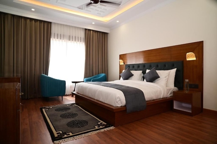 Imagen de la habitación del Hotel The Grand Orchard Resort. Foto 9