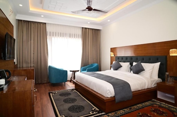 Imagen de la habitación del Hotel The Grand Orchard Resort. Foto 10