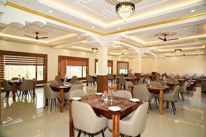 Imagen del bar/restaurante del Hotel The Grand Orchard Resort. Foto 5