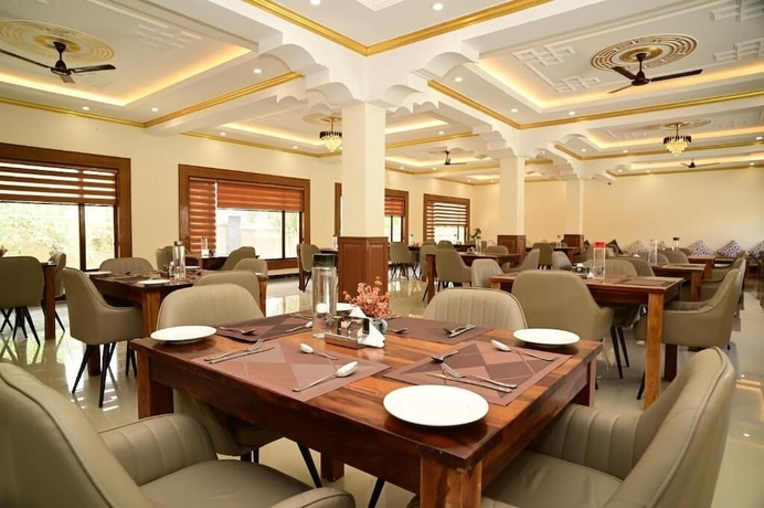 Imagen del bar/restaurante del Hotel The Grand Orchard Resort. Foto 7