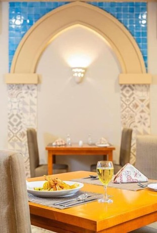 Imagen del bar/restaurante del Hotel The Grand Palace Hurghada - Adults Only. Foto 2