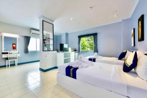 Imagen de la habitación del Hotel The Grand Paradise Suite. Foto 10