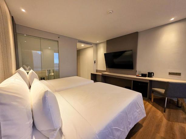 Imagen de la habitación del Hotel The Grand Platinum Jakarta. Foto 9