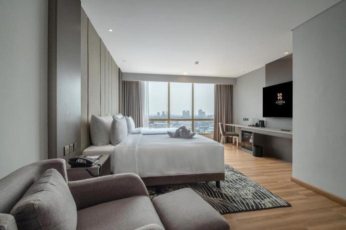 Imagen de la habitación del Hotel The Grand Platinum Jakarta. Foto 11
