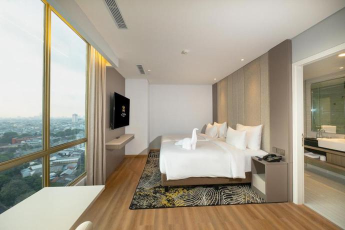 Imagen de la habitación del Hotel The Grand Platinum Jakarta. Foto 12