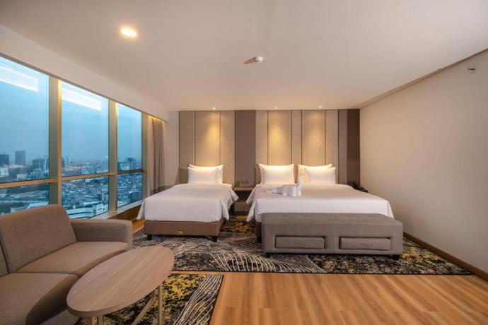 Imagen de la habitación del Hotel The Grand Platinum Jakarta. Foto 13