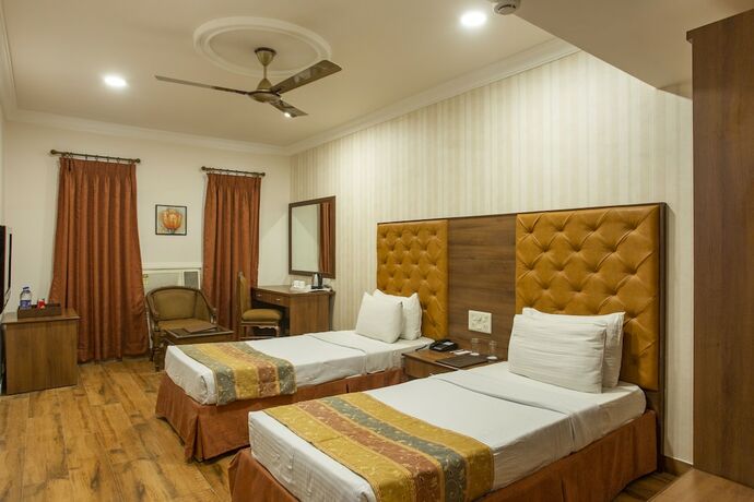 Imagen de la habitación del Hotel The Grand Regency. Foto 13