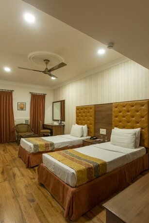 Imagen de la habitación del Hotel The Grand Regency. Foto 16