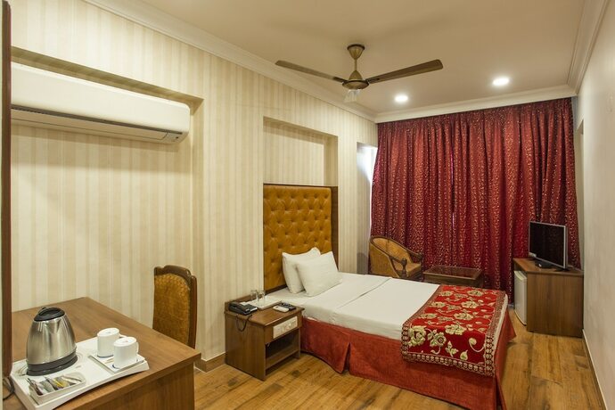 Imagen de la habitación del Hotel The Grand Regency. Foto 17