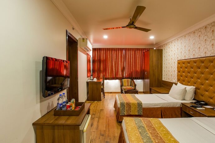 Imagen de la habitación del Hotel The Grand Regency. Foto 19