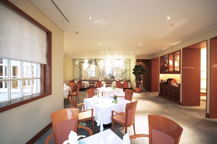 Imagen del bar/restaurante del Hotel The Grand Suite. Foto 2