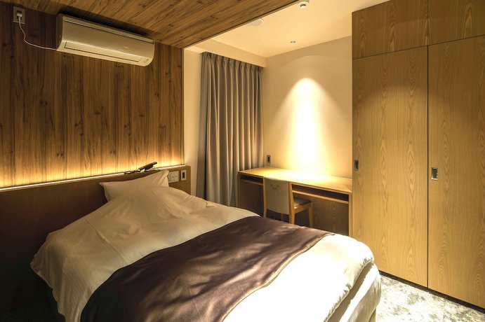 Imagen de la habitación del Hotel The Grandee Shinsaibashi. Foto 18