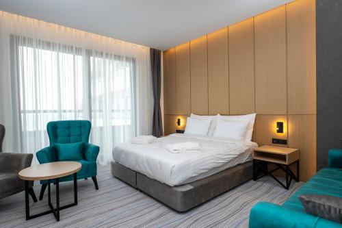 Imagen de la habitación del Hotel The Grandeur. Foto 13