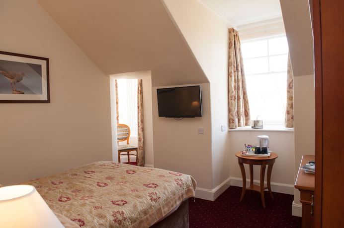 Imagen de la habitación del Hotel The Grant Arms. Foto 15