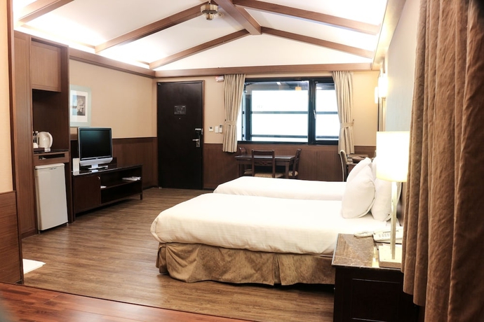 Imagen de la habitación del Hotel The Great Roots Forestry Spa Resort. Foto 7