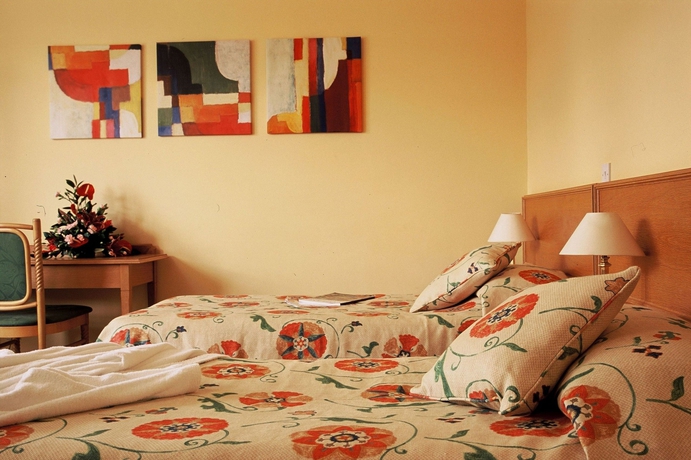 Imagen de la habitación del Hotel The Green Golf and Leisure Resort. Foto 10