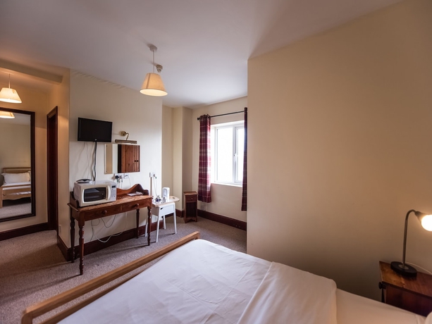 Imagen de la habitación del Hotel The Green Man Pub and Hotel by OYO. Foto 11