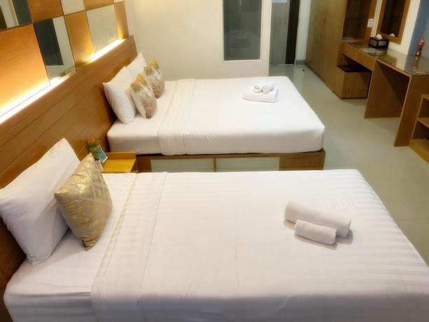 Imagen de la habitación del Hotel The Greenery Central Suites. Foto 6