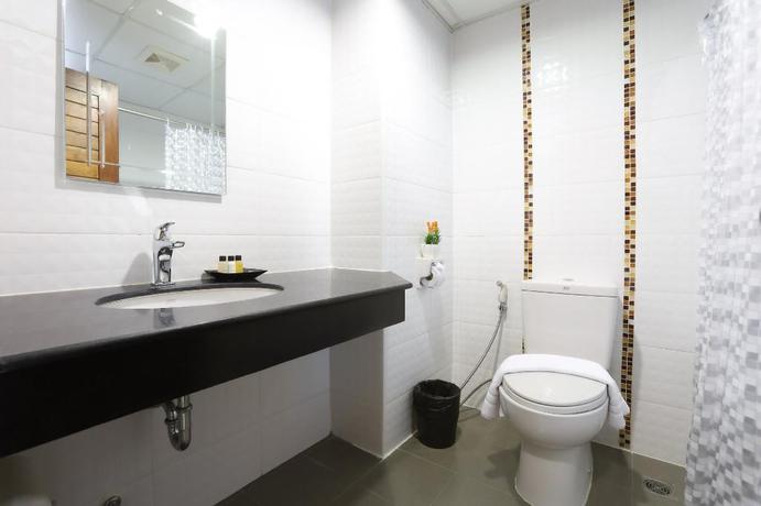 Imagen de la habitación del Hotel The Greenery Central Suites. Foto 7