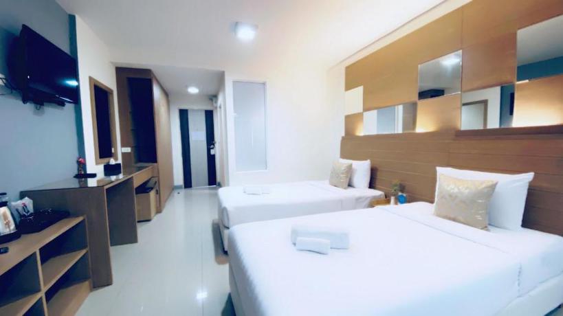Imagen de la habitación del Hotel The Greenery Central Suites. Foto 9