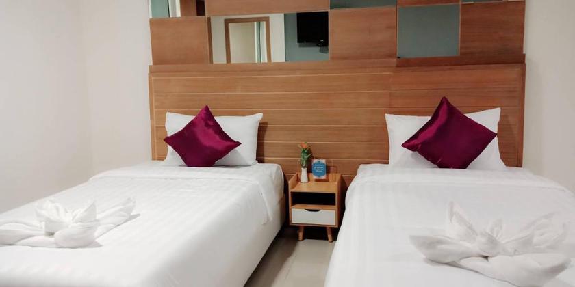 Imagen de la habitación del Hotel The Greenery Central Suites. Foto 13