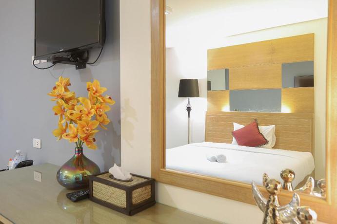 Imagen de la habitación del Hotel The Greenery Central Suites. Foto 15