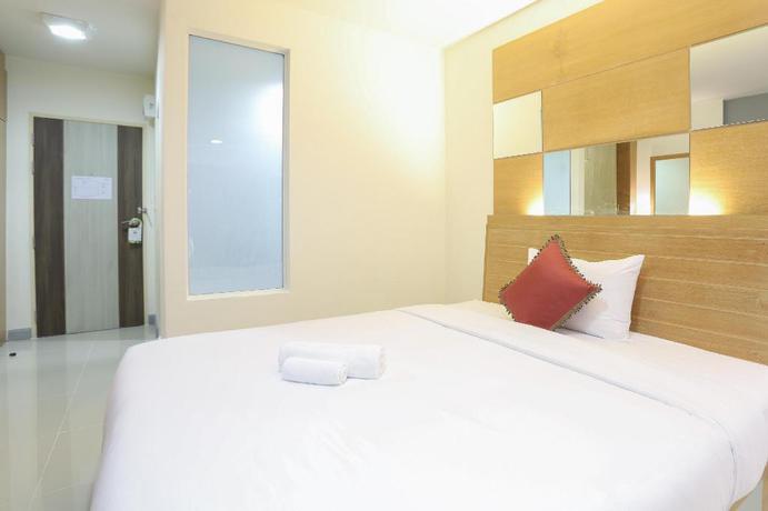 Imagen de la habitación del Hotel The Greenery Central Suites. Foto 17
