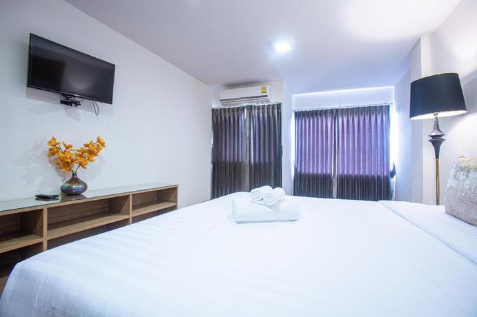 Imagen de la habitación del Hotel The Greenery Central Suites. Foto 18