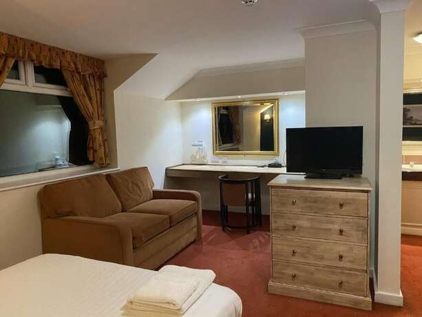 Imagen de la habitación del Hotel The Greyhound. Foto 8