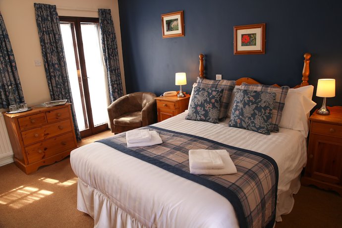 Imagen de la habitación del Hotel The Greyhound Inn and. Foto 19