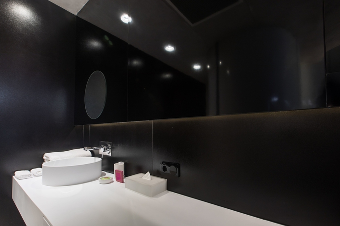 Imagen de la habitación del Hotel The Grove Design. Foto 11
