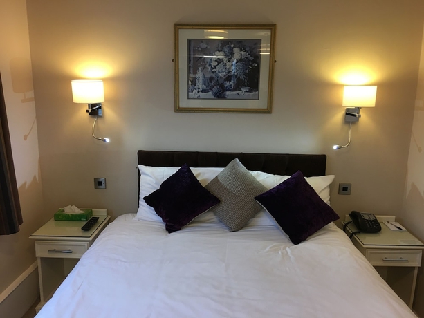 Imagen de la habitación del Hotel The Grove House. Foto 8