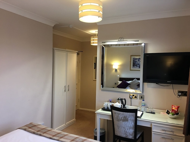 Imagen de la habitación del Hotel The Grove House. Foto 9