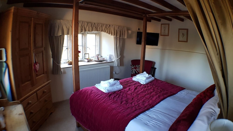 Imagen de la habitación del Hotel The Guiting Guest House. Foto 2
