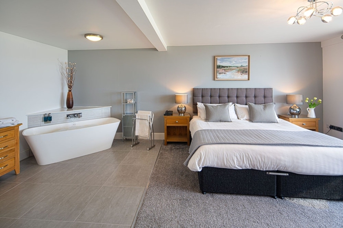 Imagen de la habitación del Hotel The Gwbert. Foto 13