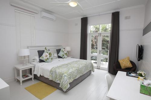 Imagen de la habitación del Hotel The Hampton Exclusive Guest House. Foto 8