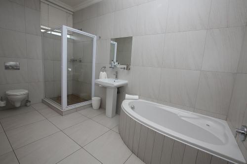 Imagen de la habitación del Hotel The Hampton Exclusive Guest House. Foto 9