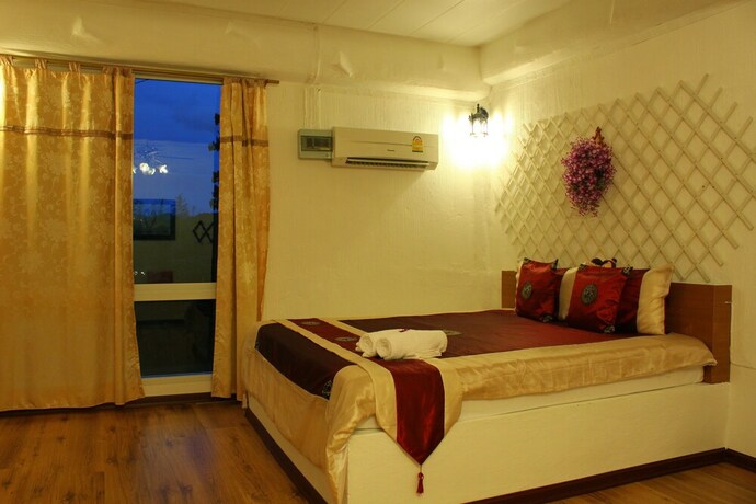 Imagen de la habitación del Hotel The Happiness Resort. Foto 22