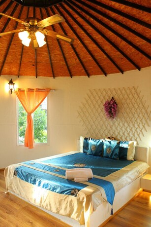 Imagen de la habitación del Hotel The Happiness Resort. Foto 27