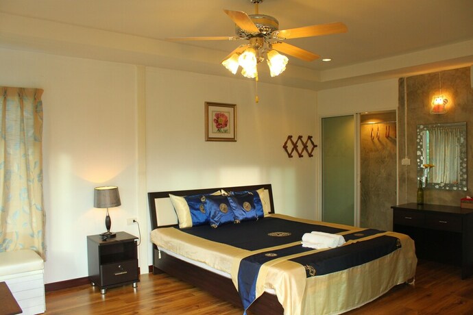 Imagen de la habitación del Hotel The Happiness Resort. Foto 35