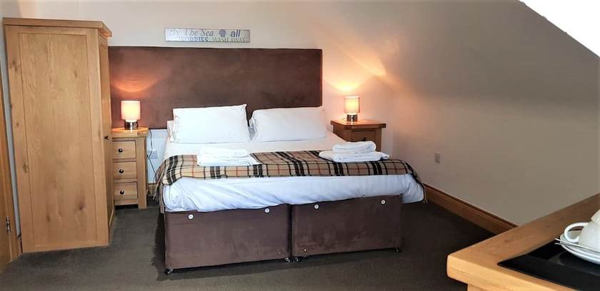 Imagen de la habitación del Hotel The Harbour House. Foto 12